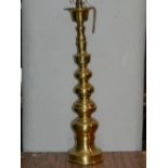 A brass floor standing lamp base of knobbed design..80cm.