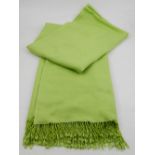 A bright green pashmina and cashmere shawl, having beaded fringes. L.210cm W.71cm