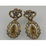 A pair of late 19th century 9ct yellow gold and white metal drop earrings set with diamonds and