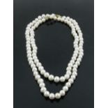 A 36 inch string of South Sea AAA pearls, with a 14 carat yellow gold clasp.