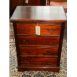 A 20th century mahogany chest of four drawers, raised on a square stepped base. H.88cm W.68cm D.