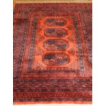 An Afghan Bokhara rug, having four pole medallion to centre, mult-bordered and fringed. L.178cm W.