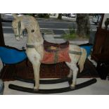 A 20th century large painted wooden rocking horse, H.140cm