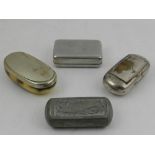 Four white metal pill boxes.