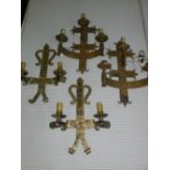 A set of four matching Gothic style three branch wall lights.