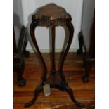 A 19th century style mahogany two tier stand, raised on cabriole legs and paw feet.