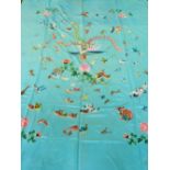 A Chinese turquoise ground silk embroidery, decorated with flowers and birds. W.140cm L.170cm