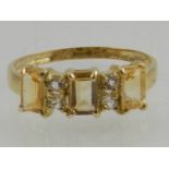 A 9 carat yellow gold, citrine and diamond ring.