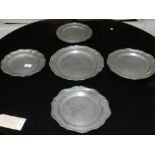 Five pewter trays, having various impressed marks to bases.