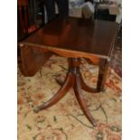 A 20th century mahogany drop-leaf breakfast table, raised on quadraped legs and casters.