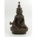 A Chinese cast metal study of a seated deity, H.24cm