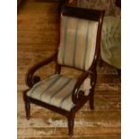 A 19th century mahogany low chair, upholstered in a blue and cream striped fabric, raised on