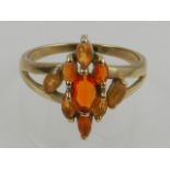 A 9 carat yellow gold and Mexican fire opal cluster ring.