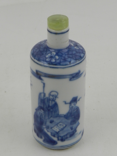 A 19th century or later Chinese shouldered cylindrical blue and white snuff bottle, decorated with a