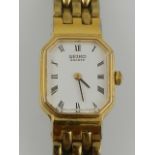 A ladies Seiko Quartz wristwatch, having gold plated strap.