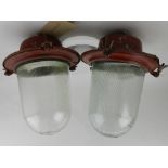 A pair of vintage 1960's Russian industrial ceiling pendants, painted red with ribbed glass