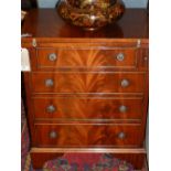 A 20th century mahogany bachelor's chest of one short above three long drawers, having a fold-out