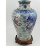A 20th century Chinese cloisonne baluster shaped vase, decorated with a dragon chasing a flaming