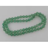A Chinese beaded jade necklace