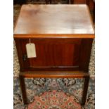 A 20th century mahogany pot cupboard, raised on square tapered legs and splayed feet. H.77cm W.