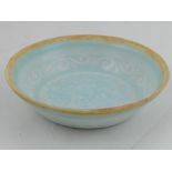 A Hutian style celadon dish, having raised decoration of scrolling foliage, 12.5cm