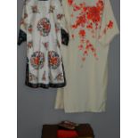 Two Japanese silk Kimonos, together with a pair of Japanese geta.