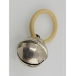 A silver child's rattle, having ivory ring, hallmarked Birmingham.