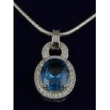 A cubic zirconia and blue topaz pendant, set in white metal stamped 925, on an omega chain, 6.6g.