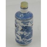 A 19th century or later Chinese shouldered cylindrical blue and white snuff bottle, decorated with a