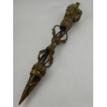 A Tibetan cast bronze phurba ritual dagger. L.62cm