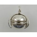 A white metal ball picture locket, stamped 925, with white metal chain.