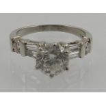 A white metal set diamond ring, the shank stamped Plat, approx. 1.6cts.