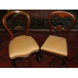 A pair of early Victorian balloon back dining chairs, together with one similar.