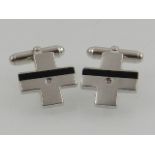 A pair of white metal and diamond set cufflinks, stamped 925.