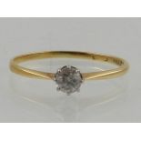 An yellow metal and diamond solitaire ring, the shank stamped 18ct, approx. 0.25cts.