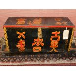 A 19th century pine coffer, gaily painted with Chinese script.