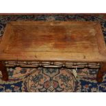 An early 20th century Chinese carved hardwood low table, having pierced and moulded frieze,