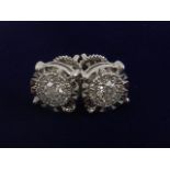 A pair of 18 carat white gold and diamond cluster earrings, the stones of approx. 0.