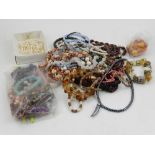 A quantity of costume jewellery, to include a garnet beaded necklace, a rose quartz necklace,