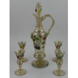 A 20th century German iridescent glass liquer set, decorated with trailing fruit,
