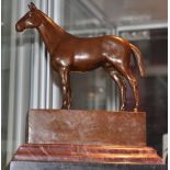 After Andre, a patinated bronze of a horse on a rouge marble plinth,