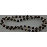 A baroque style necklace of white and black alternating freshwater pearls