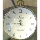 A large brass and glass ball clock