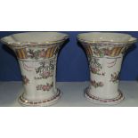 A pair of Continental vases of lobed oval form and flared bases decorated with floral sprays