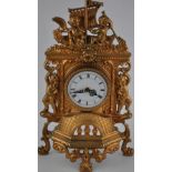 Baroque-style gilt metal clock with battery-powered quartz movement. H.
