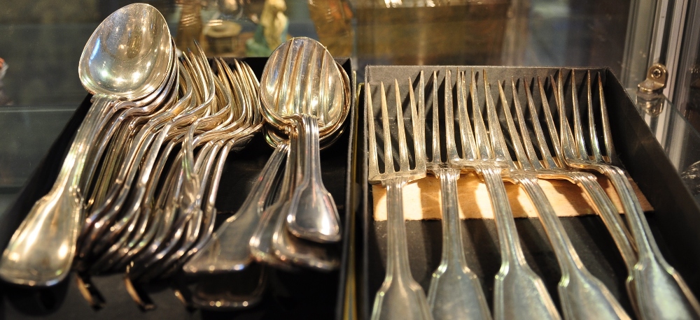 A quantity of white metal Fiddle and Thread flatware comprising 11 dessert forks, 6 dessert spoons,