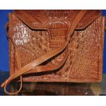 A ladies vintage crocodile skin handbag