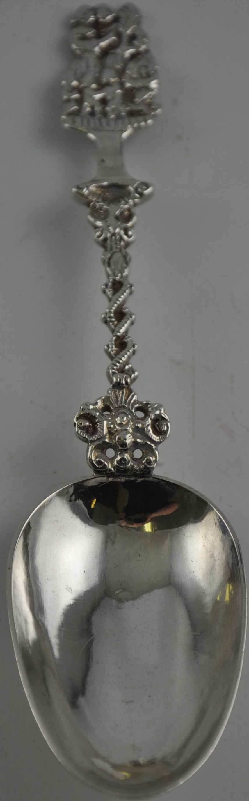 An 18th Century Dutch silver Christening spoon with rat tail bowl and cast handle with family