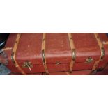 An early 20th Century woodbound leather and brass mounted travelling trunk