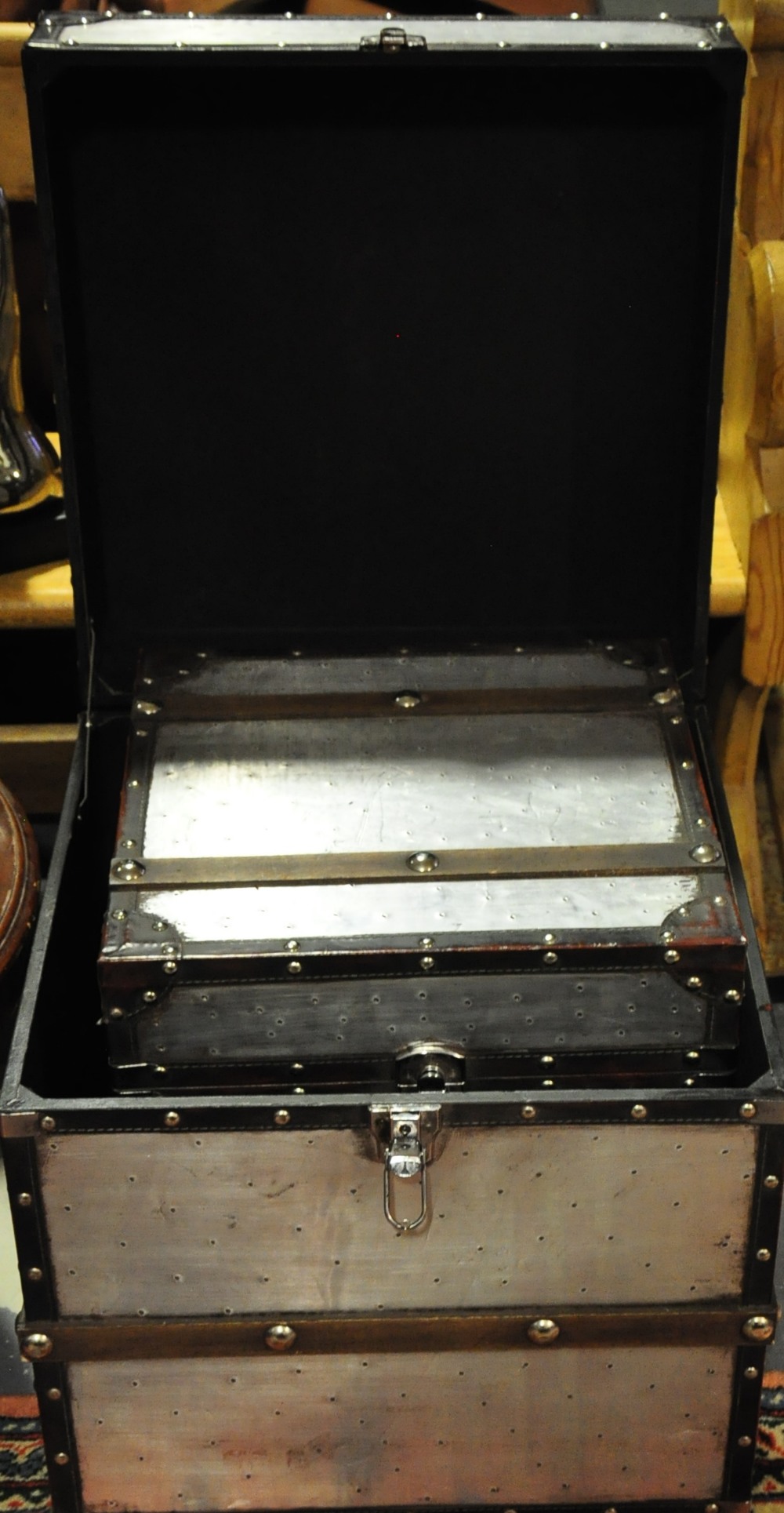 A pair of aluminium and wooden leather trunks